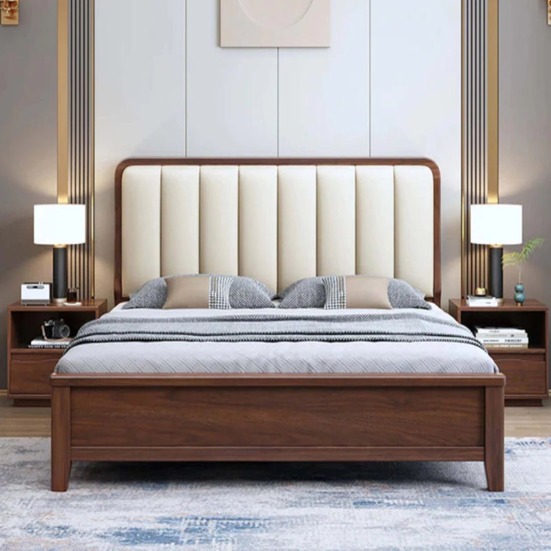 Wooden bed with beige upholstered headboard in a bedroom setting